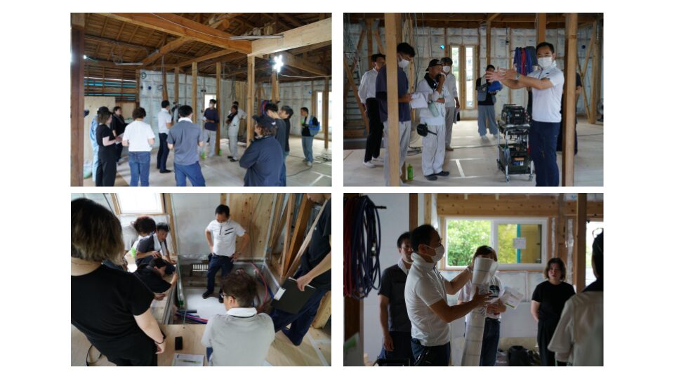 職人やスタッフがリノベーション現場に集まり、気密施工や断熱納まりについて実地で確認・打ち合わせしている様子